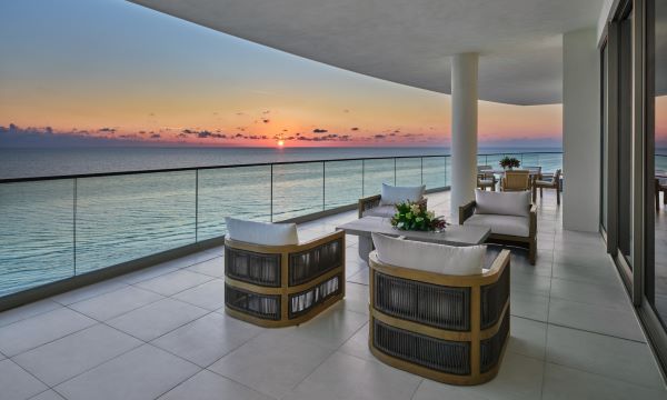 Photo of a sunset off in the distance, looking out from the balcony of the Presidental Suite at the St. Regis Resort on Longboat Key.