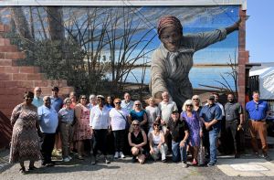 Tour group in front of Harriet Tubman mural