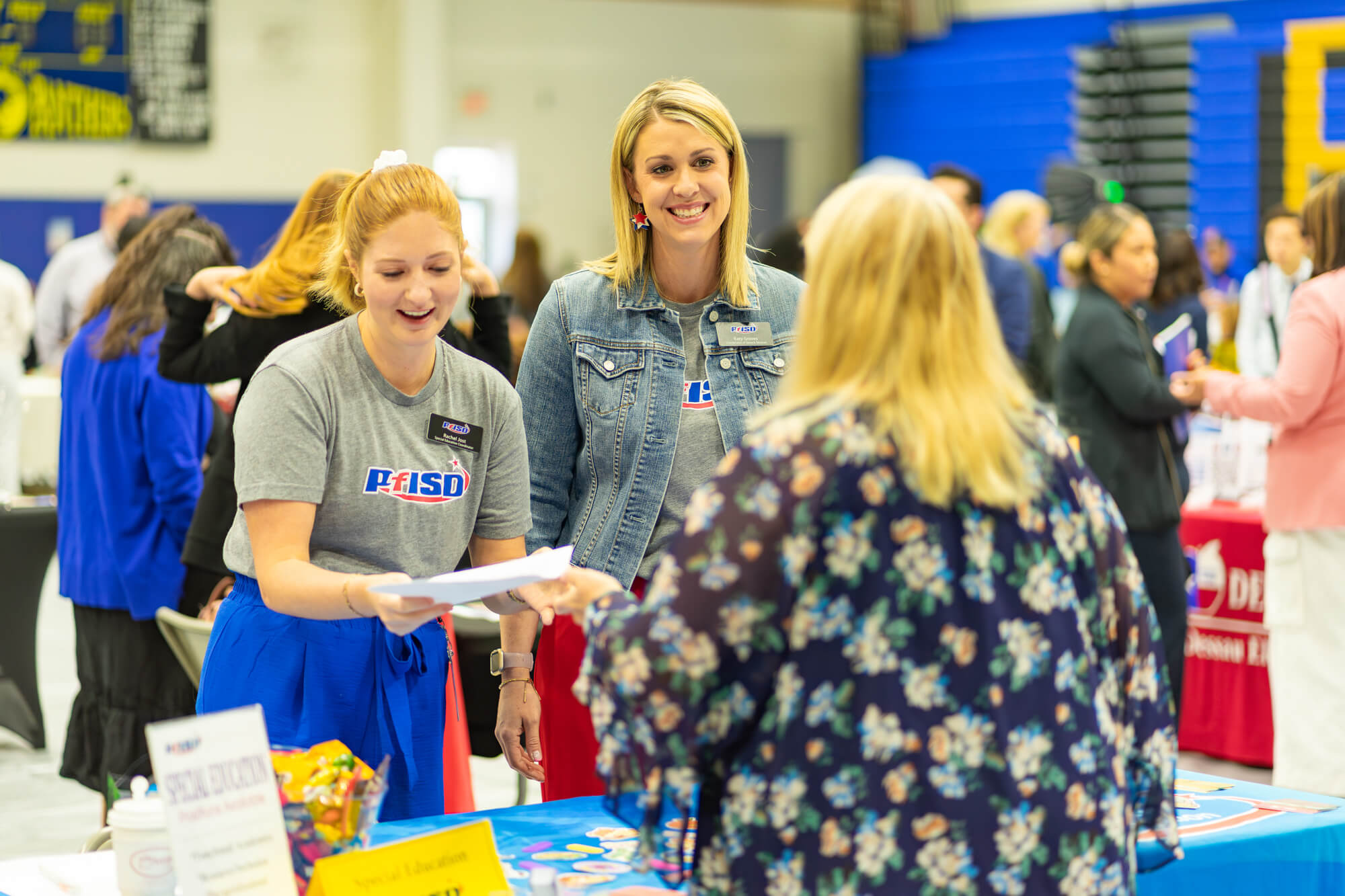 Connecting with future educators—Pflugerville Independent School District representatives engaging with passionate professionals ready to make an impact in the classroom.