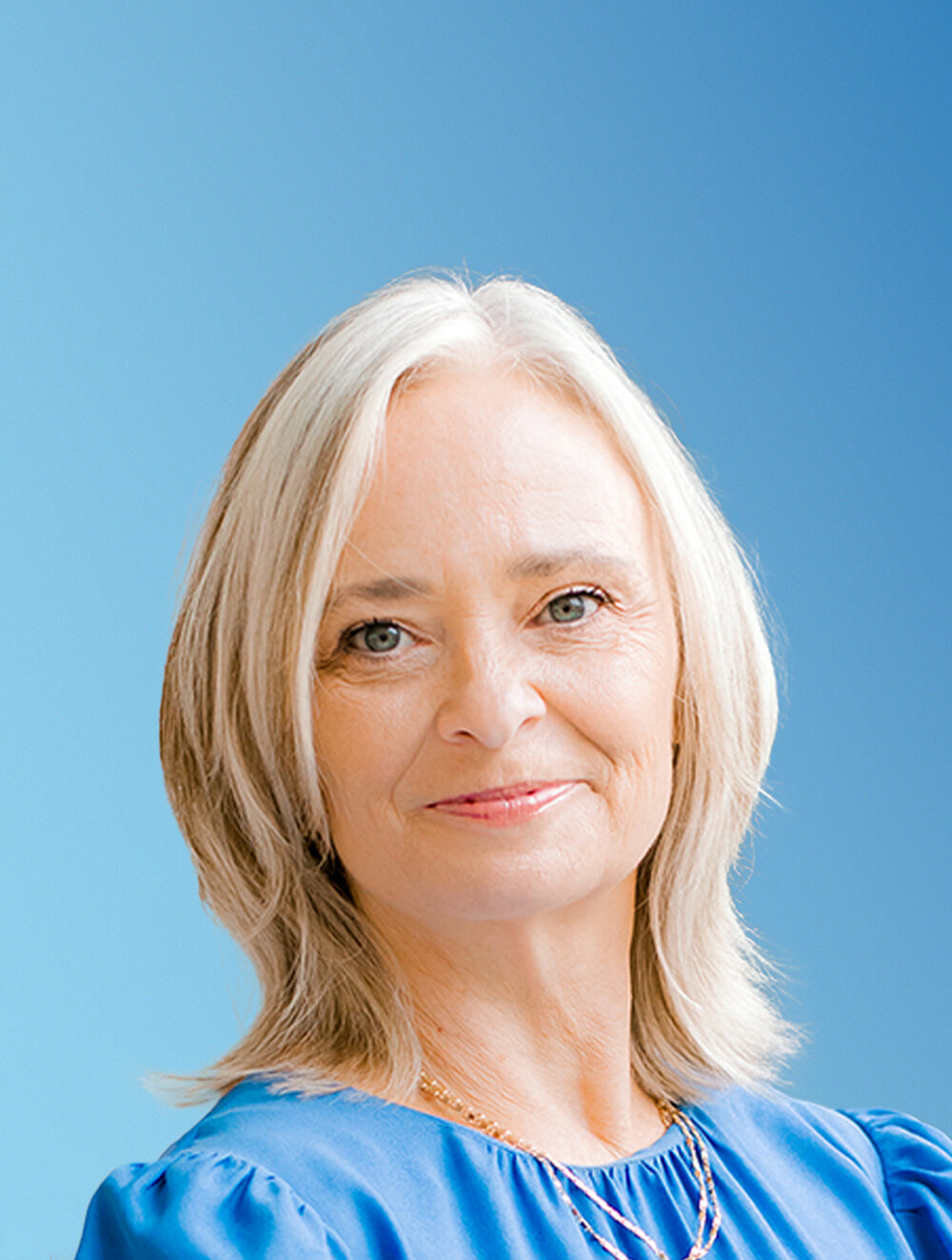 Lesia Aguilar Blue Backdrop Headshot - 11.12.24 Lesia Aguilar Blue Backdrop Headshot - 11.12.24