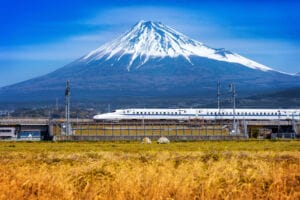 Fuji mountains and high-speed train in Shizuoka, Japan.