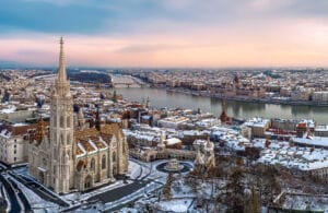 Aerial cityscape from Budapest with cloudly sky, Matthas church, fishermans bastion, Danube river and Hungarian Parliament.