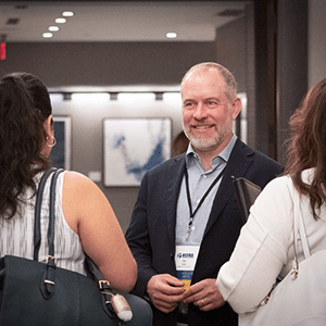 man talking to 2 people