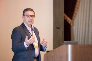 man at podium talking