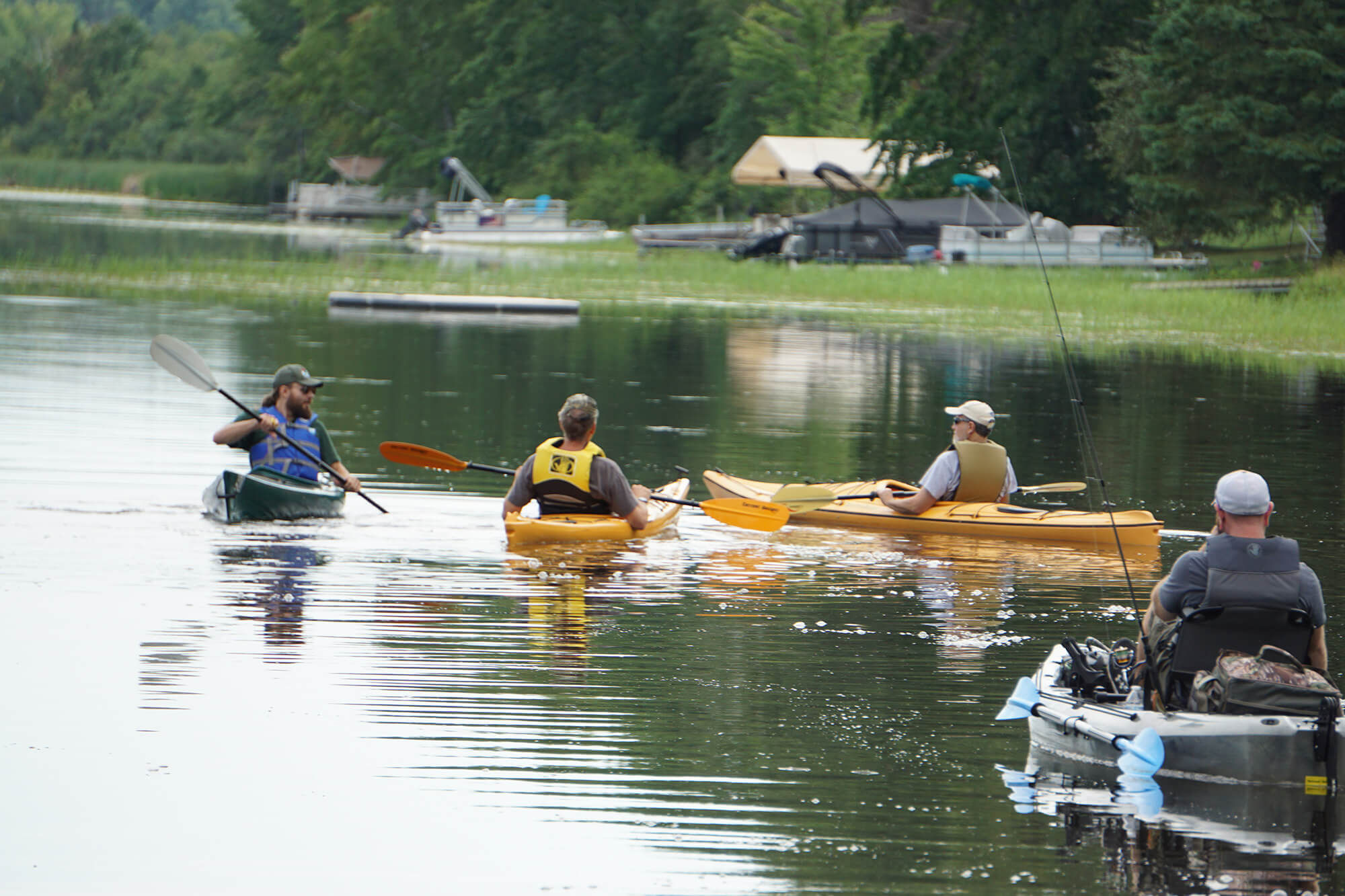 The small group enjoys a peaceful and interesting tour of Lake Alexander