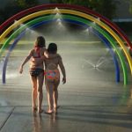 Children playing in sprinklers