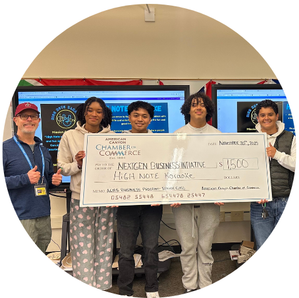 kids standing behind large check for next gen