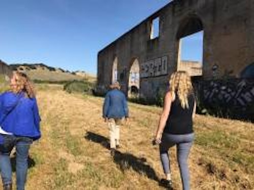 Ruins_Tour_248x186 people walking through american canyon ruins site