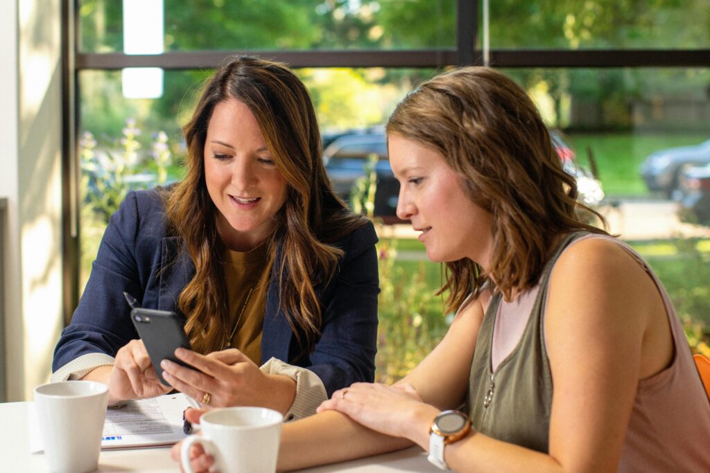 Two women together having coffee deep in discussion