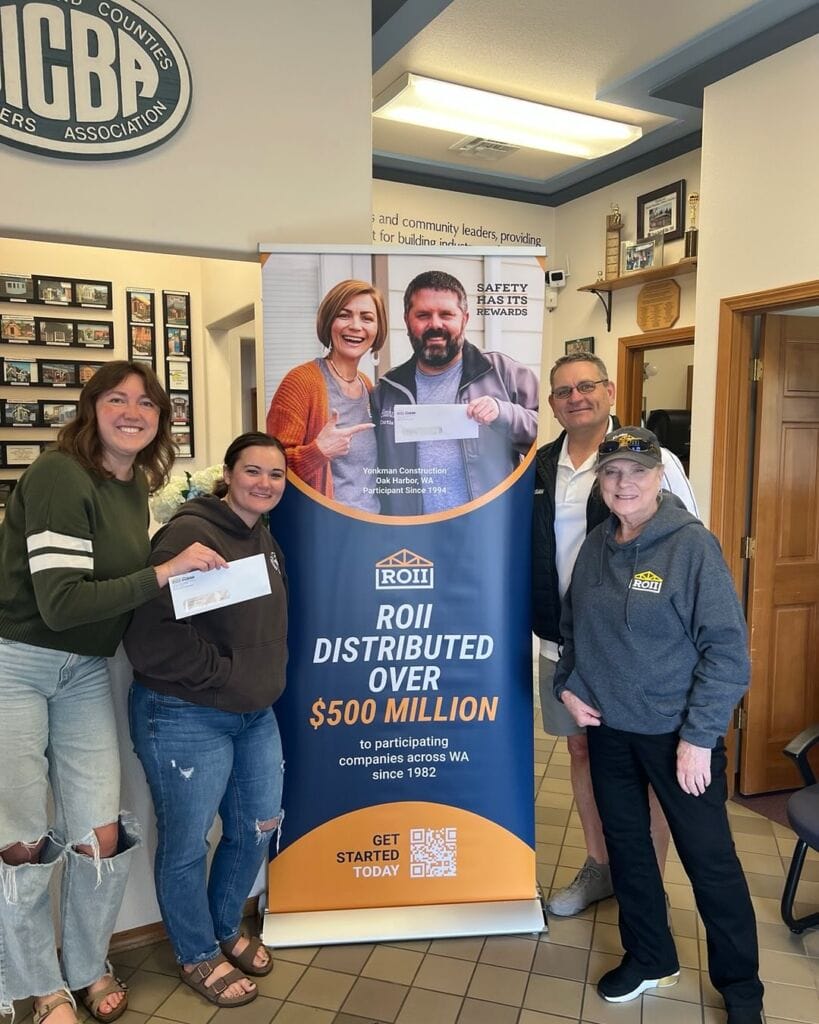 BIAW staff and members presenting a rebate check to ROII participants during the annual Return Check Party