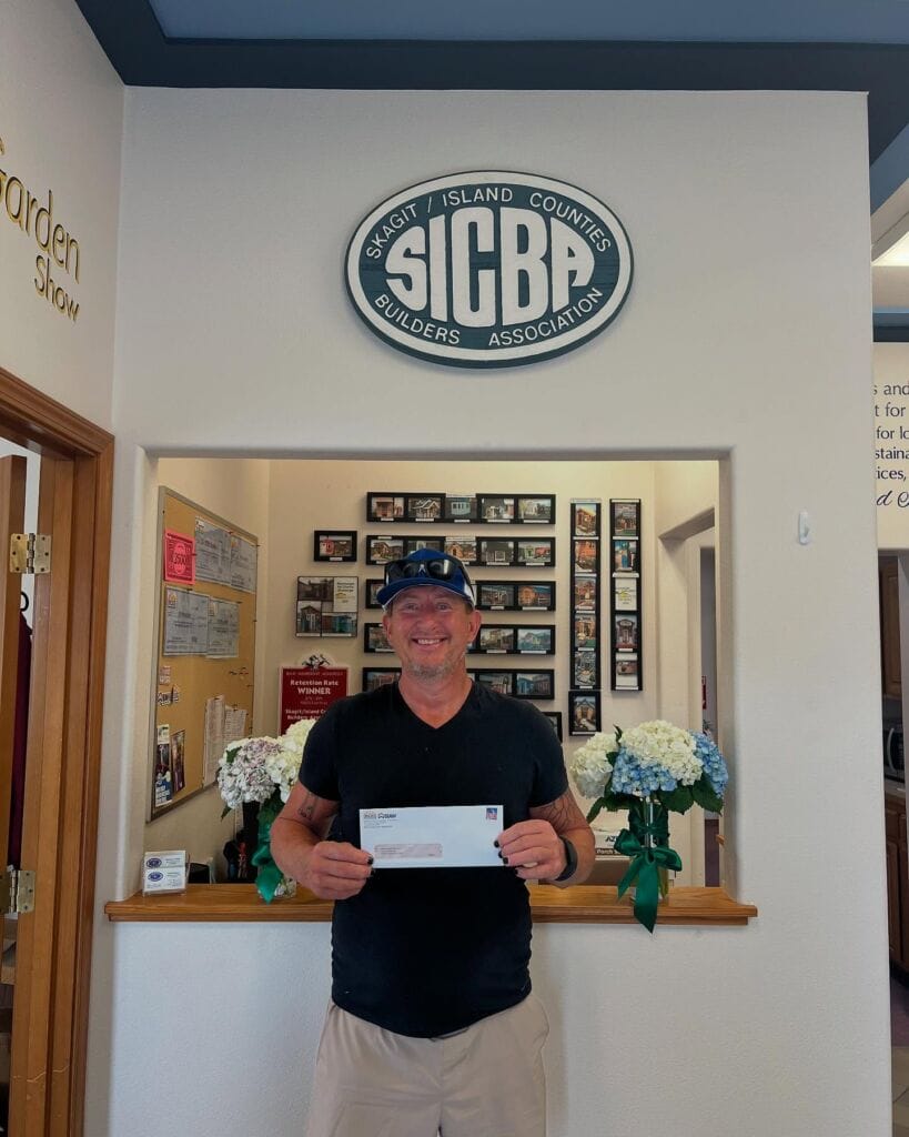 SICBA member presenting a rebate check to an ROII participant at the Return Check Party