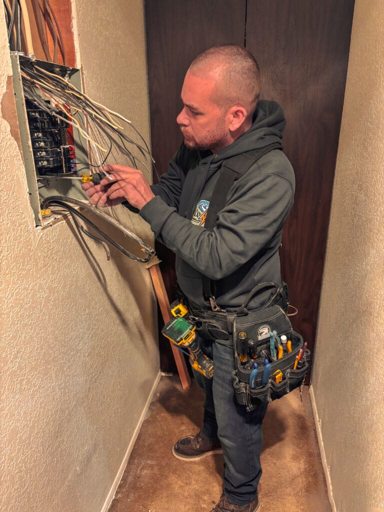 Licensed electrical contractor performing an electrical panel upgrade in a residential home in Skagit Valley WA.