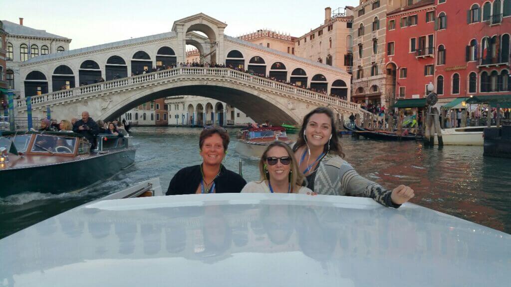 Women in front of bridge in Venice, Italy