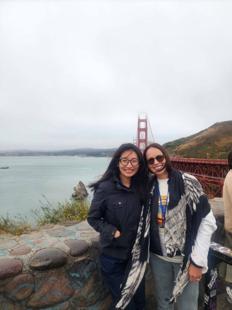 Two women in front of the Golden Gate Bridge