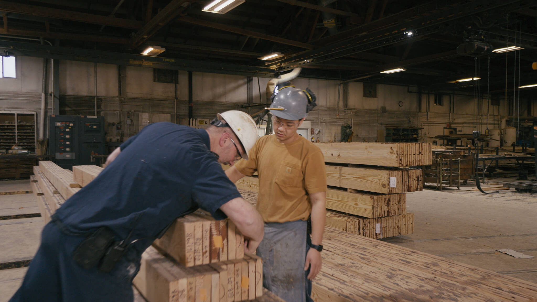 still from Passion Pursuit video showing two men doing woodworking
