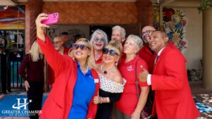 People talking and posing for a group photo at one of the community business events in Harlingen TX