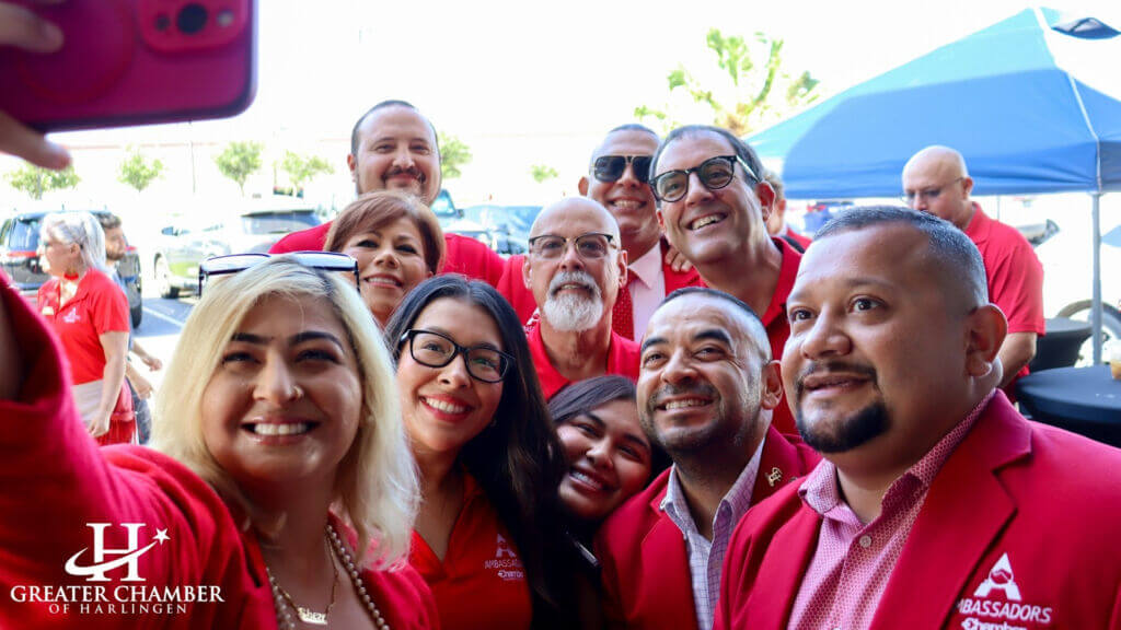Members of the Greater Chamber of Harlingen taking a group picture at a local business event