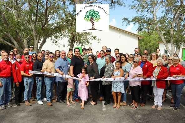 Ribbon cutting celebration for Mesquite Treatment Center with staff and guests