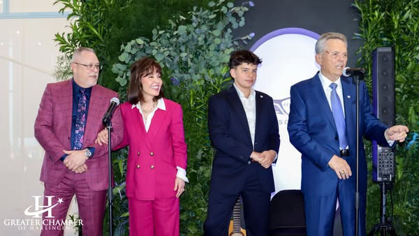 Harlingen community leaders at a store opening