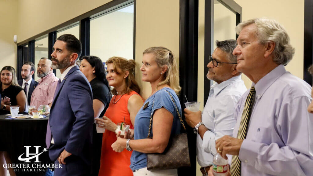 Community leaders attend an office opening event that reflects collaborative initiatives in the Harlingen business community.