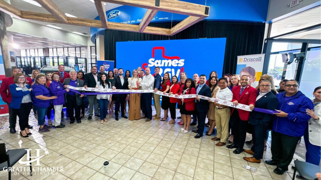 Community members exploring new cars and prizes at Sames Harlingen Ford Grand Opening, reflecting What Is the Main Purpose of the Chamber of Commerce in driving local engagement.