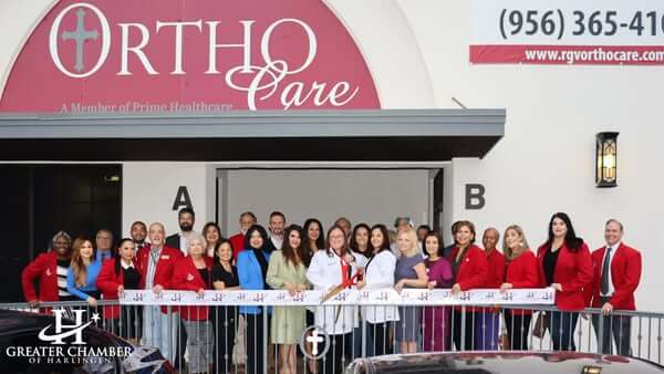 Ribbon cutting ceremony with OrthoCare and the Greater Chamber of Harlingen, celebrating advanced orthopedic care and community support.