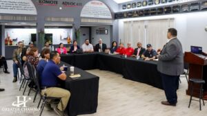 Attendees networking at a Business Over Breakfast event in Harlingen.