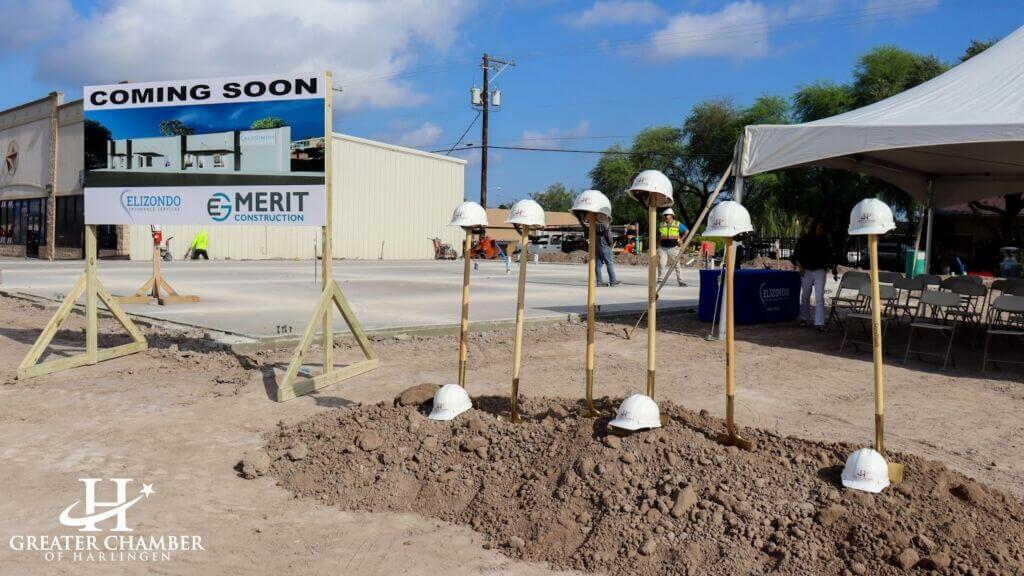 Construction site with shovels and hard hats set up for a new commercial property for businesses in Harlingen.