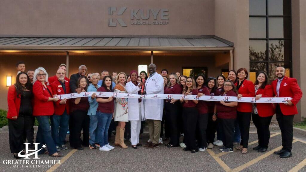 A large group of Chamber members and clinic staff gather for a ribbon cutting at Cano Medical Center with Kuye Medical Group, reflecting community support.