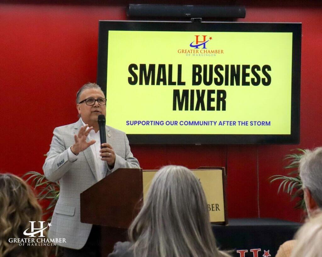 Chamber president giving guidance during a community meeting, aligning programs and initiatives with member needs