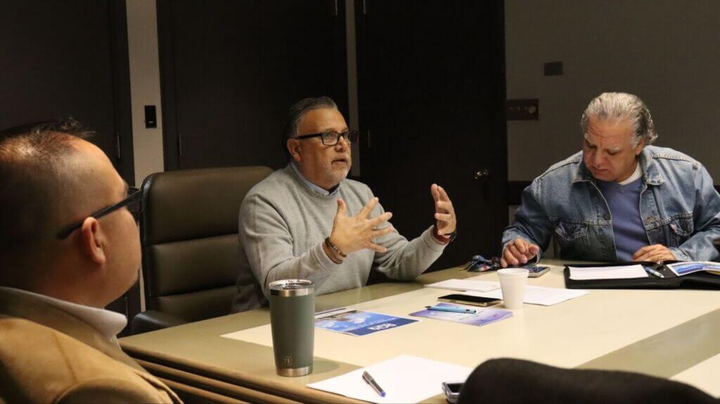 Chamber staff and members participating in a ribbon-cutting, mixer, or workshop—showing visibility and engagement in action.