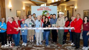 Members of the Greater Chamber of Harlingen join the ribbon cutting at the Rio Grande Valley Birding Festival at the Harlingen Convention Center. This birding festival is one of the top things to do in Harlingen.