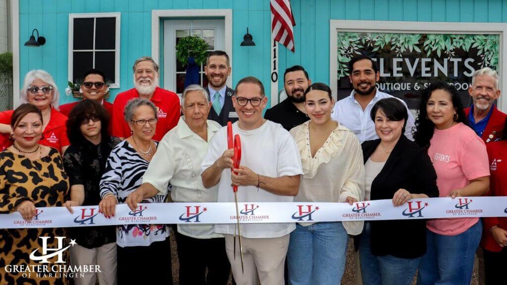 Greater Chamber of Harlingen staff celebrating a ribbon-cutting with a local business to mark a grand opening.