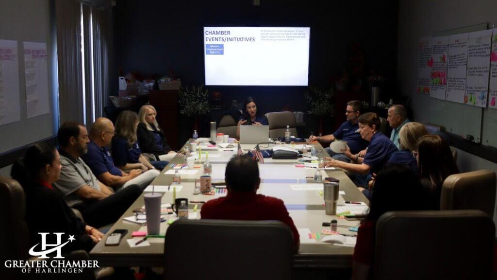 Chamber staff interacting with a business owner to provide guidance and practical connections
