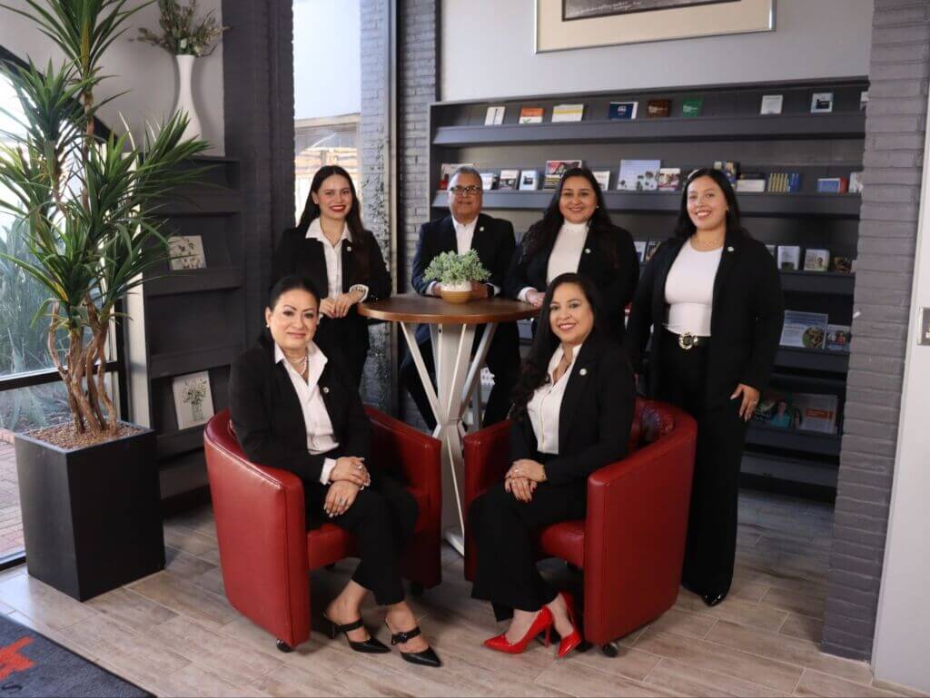 Greater Chamber of Harlingen staff smiling together in the office, ready to support local businesses with guidance, connections, and member services.