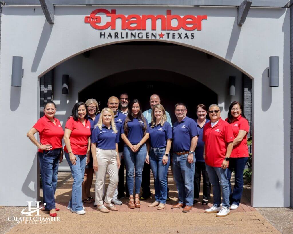 Group photo of Chamber staff standing together outside the Greater Chamber of Harlingen building, highlighting the people who support local businesses and community initiatives.