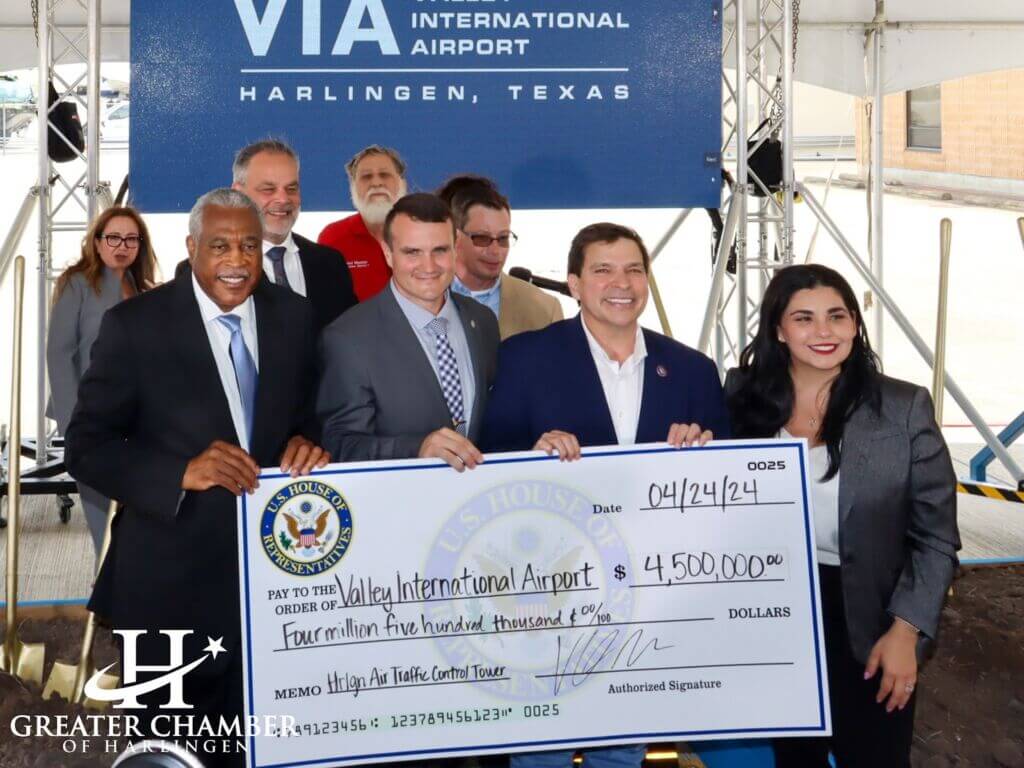 Leaders and Chamber representatives present a ceremonial check at Valley International Airport during the air traffic control tower groundbreaking.