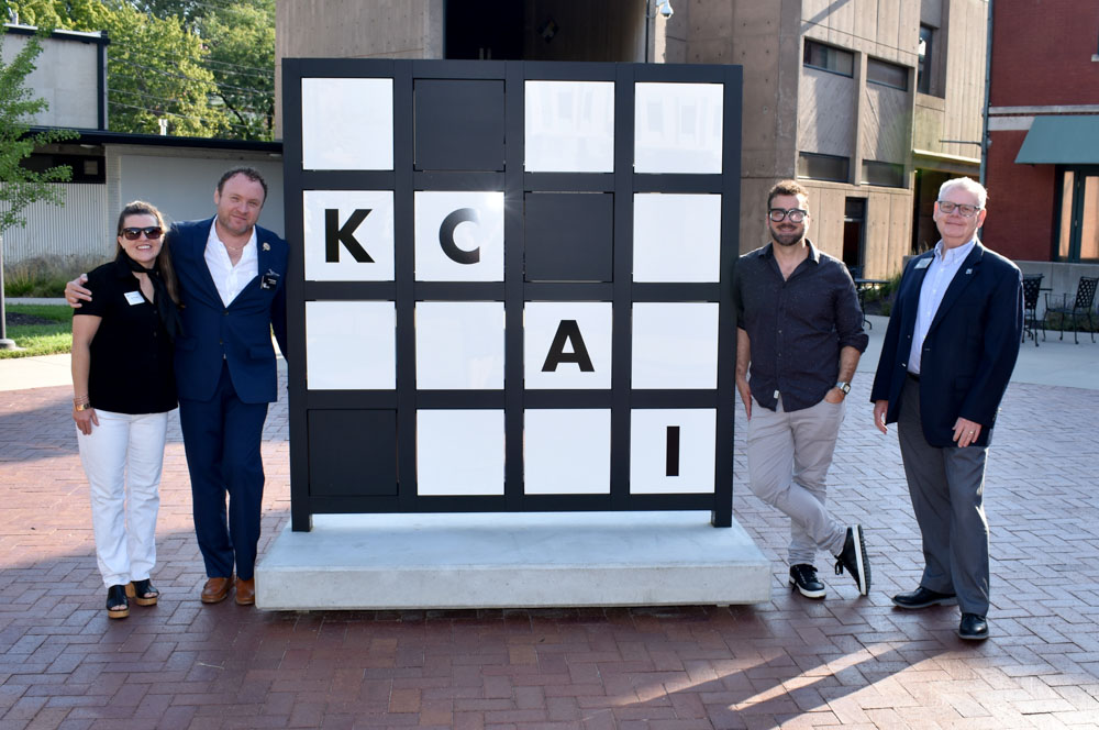 From left, Kate Nielsen, LGBT Chamber Board President, Chadwick Brooks, Assistant VP of Institutional Advancement, Robert Gann, Manager of Special Events, and Randy Williams, AVP Corporate and Community Partnerships pose for a photo during the LGBT Chamber of Commerce Coffee Connections held at KCAI, Tuesday, Aug. 27, 2024.