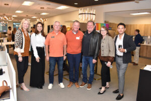 ReeceNichols agents pose for a photo during the Sep. 24, 2024, LGBT Chamber of Commerce Coffee Connections. From left to right, Amy Ringsdorf, Brecklyn Wright, Brian Partlow, David Slawson, John Price, Amy Loehr, and Fabián Gayosso.