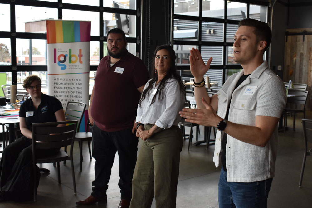 James Maiden, right, speaks during the Workforce SynQ Social, Monday, Oct. 28, 2024, at Chicken N Pickle. Also pictured is Steven Barnett, second from left, and Michelle Fontes.