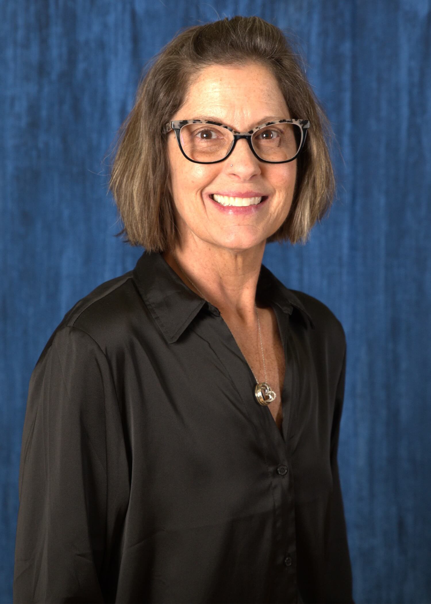 A headshot photo of Rachel Reinhard.