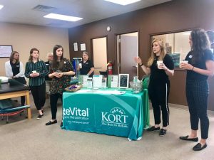 Kort giving a presentation during their breakfast.