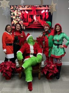 Nancy Turner, Erika O'Brien, The Grinch, Ryan Case, and Cindy Banks host a Chamber Breakfast