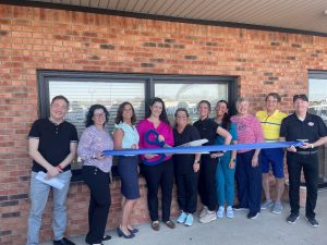 Dr Jessica McClanahan- Wasson cuts the ribbon celebrating Healthy Smiles of the Bluegrass, LLC Membership