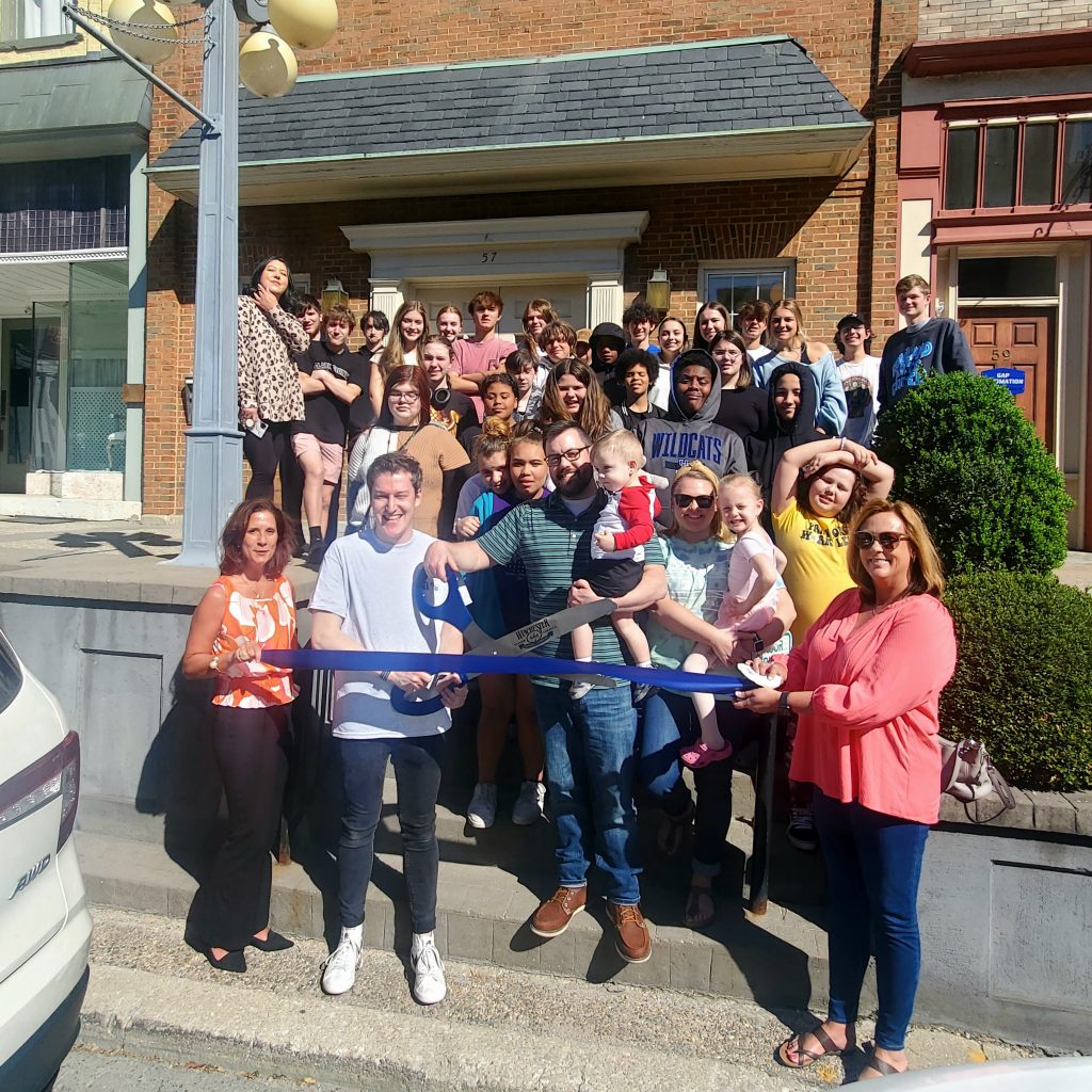 Joseph Miller cuts the ribbon celebrating The Rowland Arts Center’s membership into the Winchester-Clark County Chamber of Commerce.