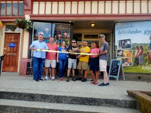 Ernie Wesley cuts the ribbon celebrating Bluegrass Bounce House membership into the Winchester-Clark County Chamber of Commerce.