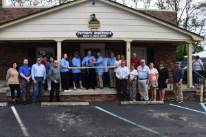 Scott Seitz cuts the ribbon celebrating Partners Healthcare membership into the Winchester-Clark County Chamber of Commerce.