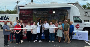 Chelsea Walker cuts the ribbon celebrating Foothills Health & Wellness Mobile Unit membership into the Winchester-Clark County Chamber of Commerce.