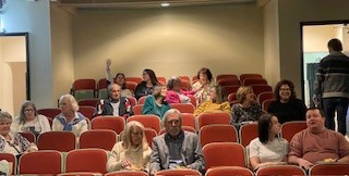 After Hours guests sit in the audience.