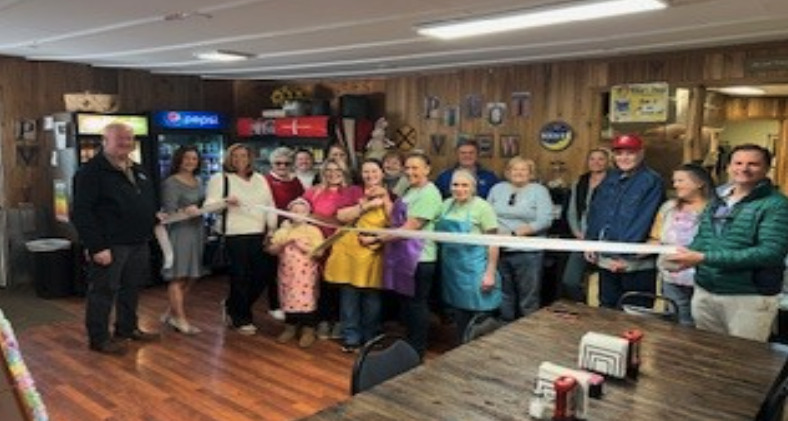 Tricia Lawson & Tanna Howard cut the ribbon celebrating Pilot View Market and Bakery, LLC membership into the Winchester- Clark County Chamber of Commerce. Pilot View Market and Bakery, LLC located 7695 Ironworks